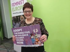 Figure 2: Dr. Bettina Pfleiderer, EWL Vice-President and MWIA representative to EWL, displays a campaign poster for the adoption of the Violence Directive at the EWL Board meeting in Brussels, 17-19 February 2023.