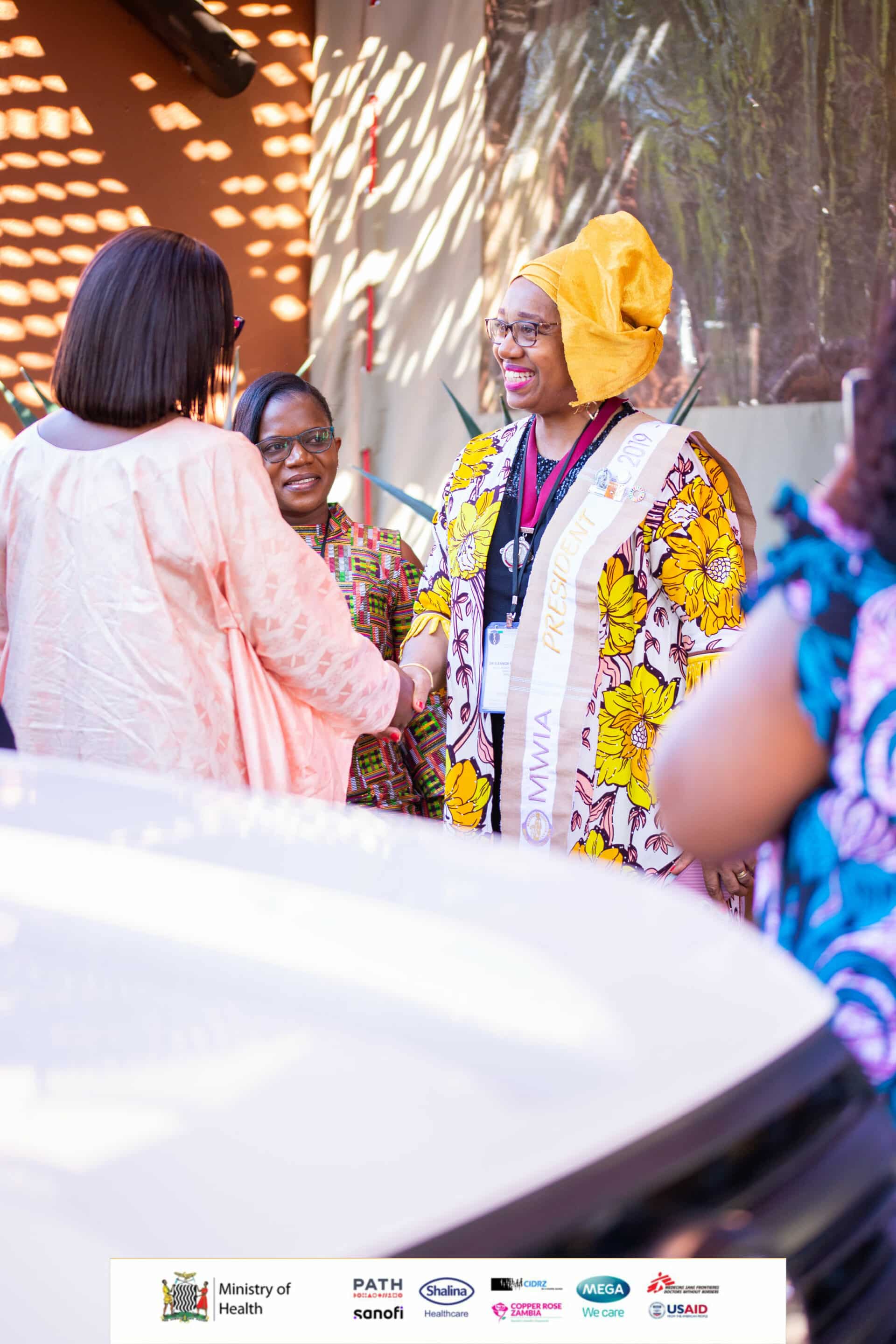 Fig 1. MWIA President, Dr Eleanor Nwadinobi, meeting and welcoming the Zambian Minister of Health, Ms Sylvia Masebo, to the 10th Regional Congress for Near East and Africa, in Livingstone, Zambia, while MWAZ President, Dr Joyce Sakala looks on